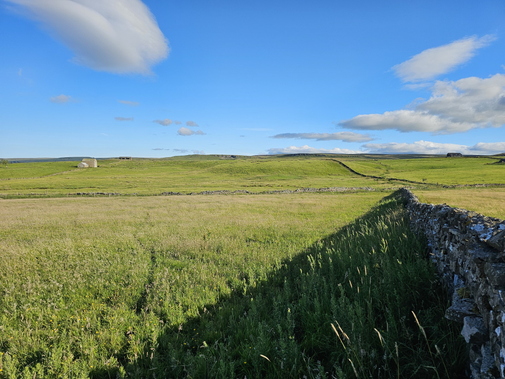 Setting sun creating a shadow along the western boundary wall